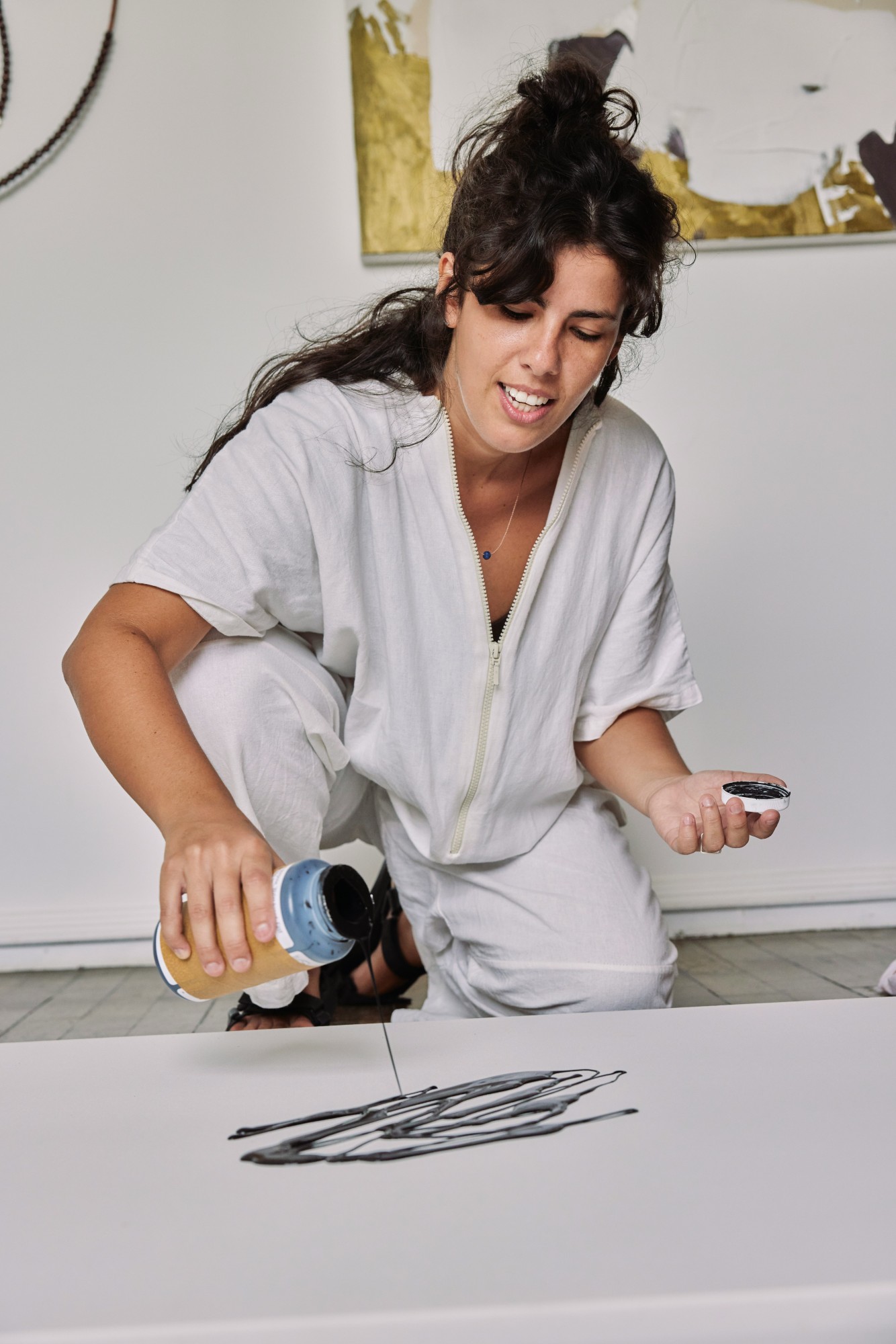 Independent artist managing project expenses and income through Rounded while creating artwork.